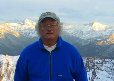 Joe Jordan on snowy High Sierra peak